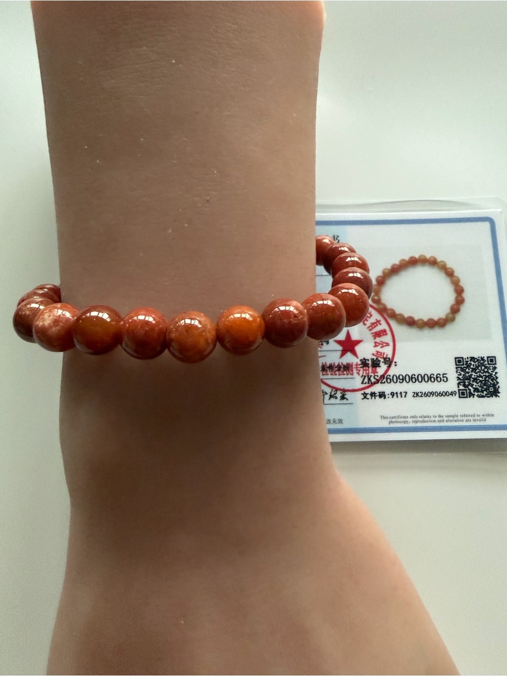 Authentic red jade bracelet.. comes with certificate